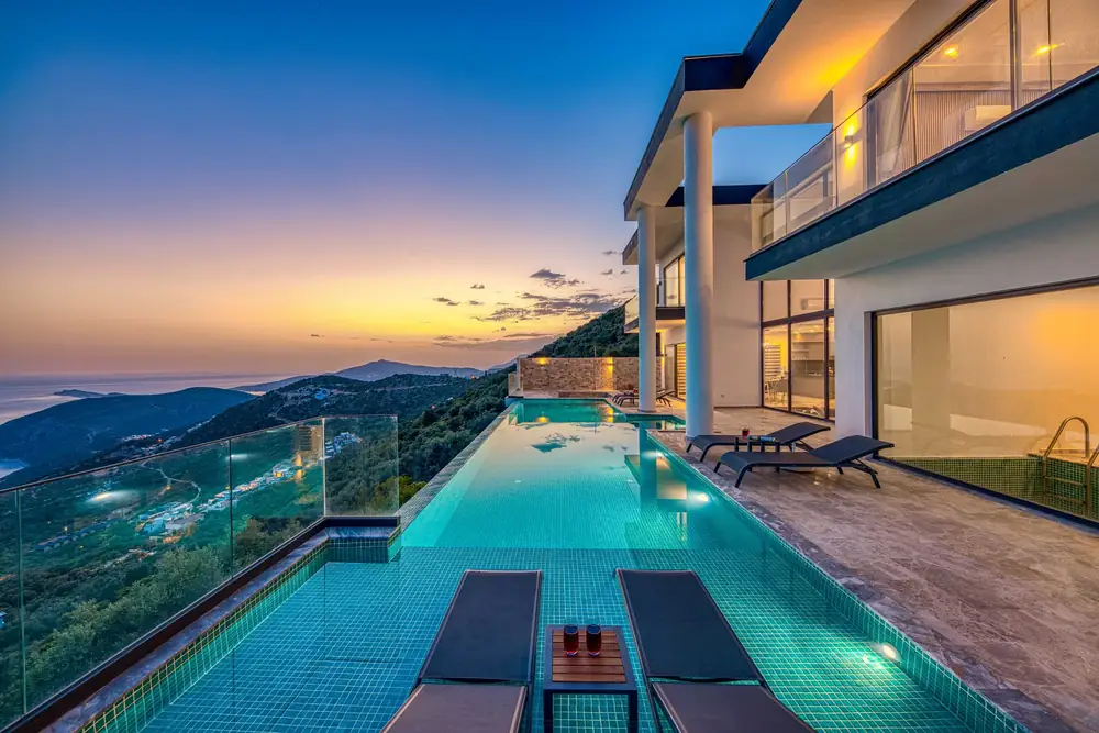 Infinity pool overlooking the coastline at dusk